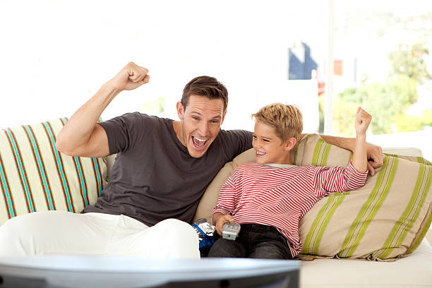 istock Watching sport on TV with Dad 511995072