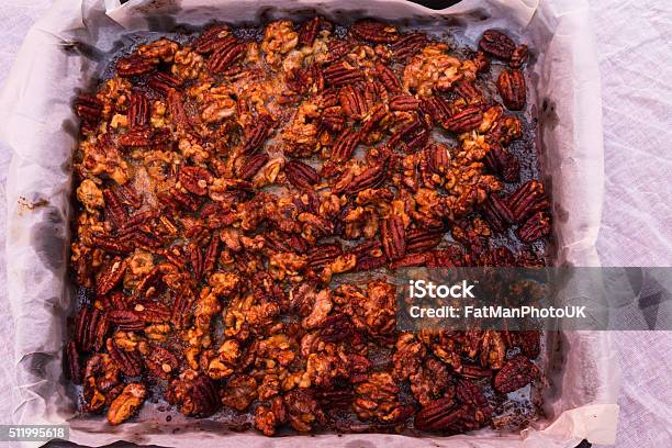 Mixed Garlic And Rosemary Roasted Nuts Cooked And Cooling Stock Photo - Download Image Now