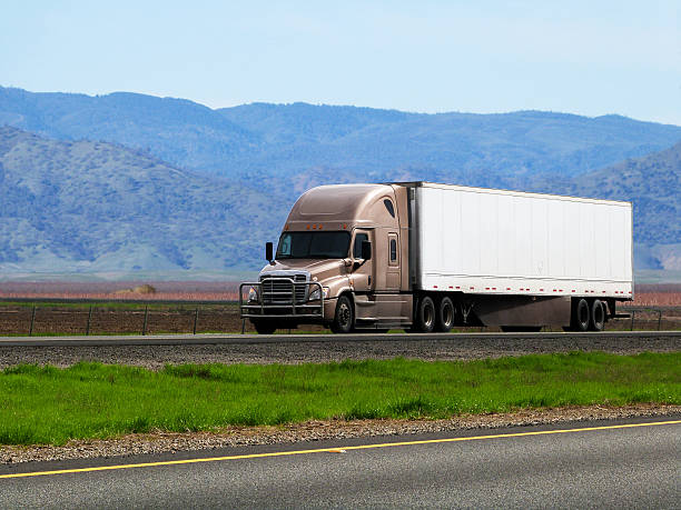 istock Semi Tractor Truck Trailer on Interstate Highway Freight Transportation Industry 511997614
