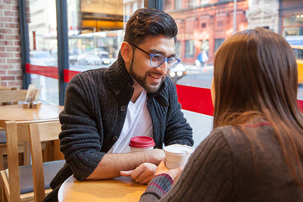 istock Multi-Ethnic Couple having coffee together 511998060