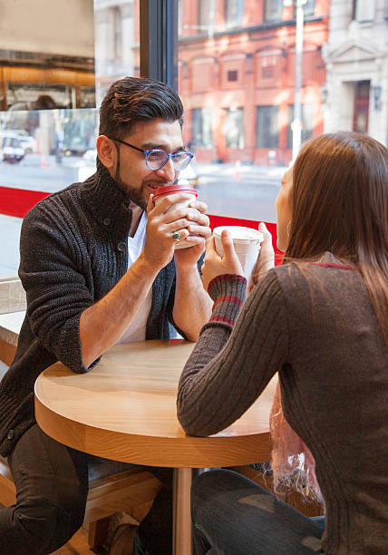 istock Multi-Ethnic Couple having coffee together 511998160