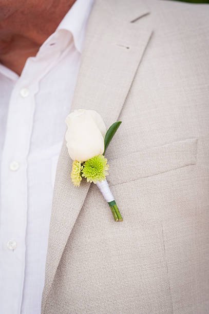 istock White rose boutonniere 511998918