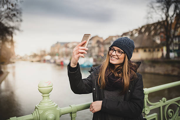 istock Woman looking at mobile phone 512002080