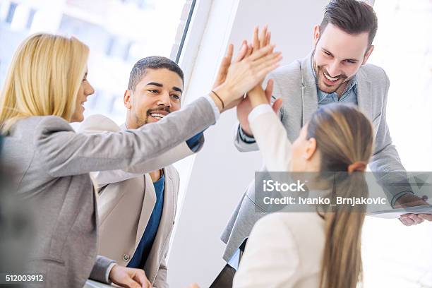 Young Business People Joining Hands Together For Success Stock Photo - Download Image Now