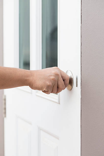 istock hand hold handle of wood door 512005514