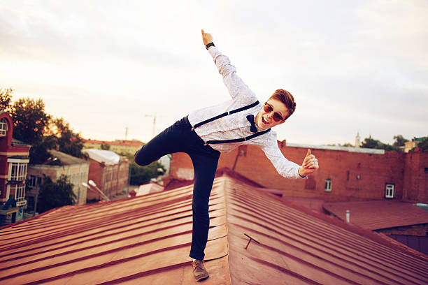 istock Young happy hipster girl jump on roof 512011121