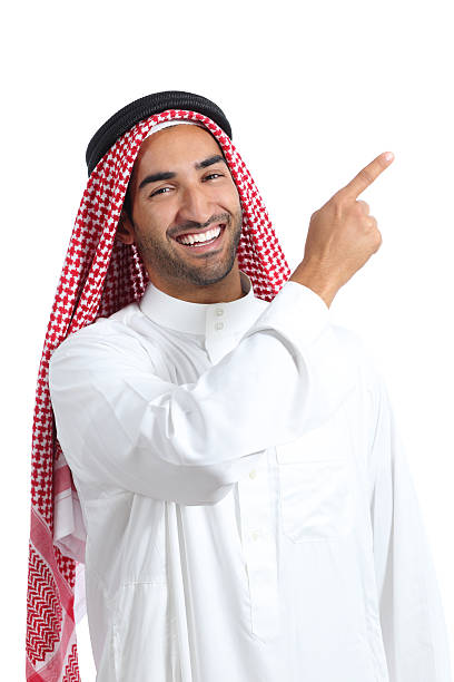 arabische saudi veranstalter mann zeigt an der seite - moving up child pointing looking stock-fotos und bilder