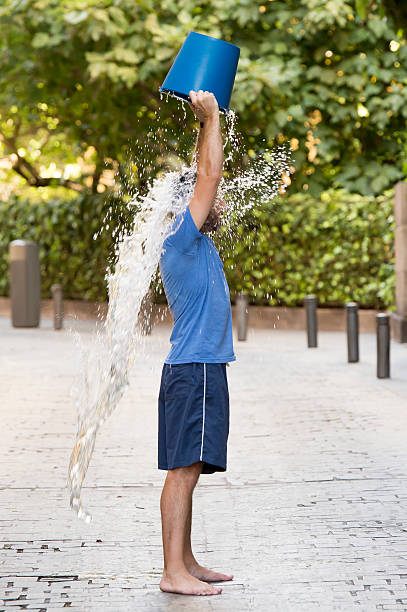 istock man pouring ice bucket on internet viral media campaign 512013051