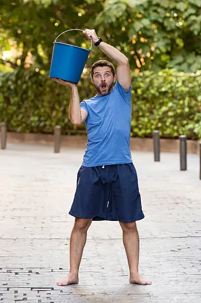 Photo of man pouring ice bucket on internet viral media campaign