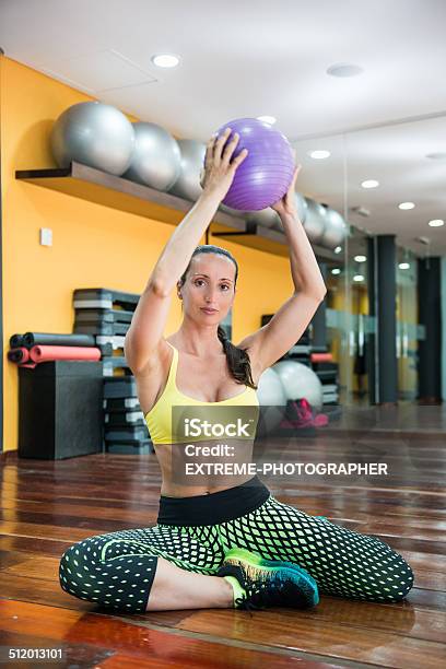 Woman Exercising With Ball Stock Photo - Download Image Now - Active Lifestyle, Activity, Adult