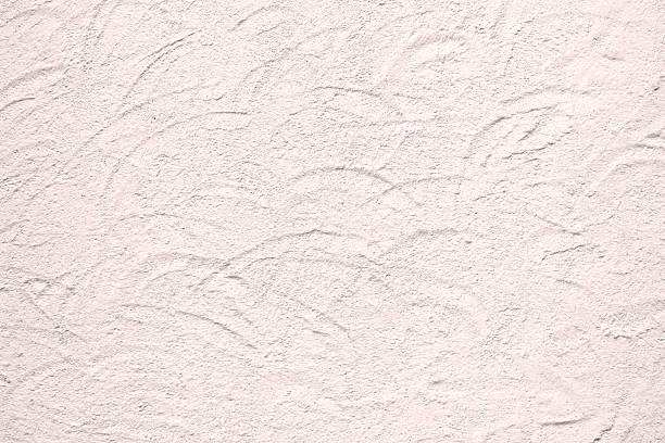 istock Texture of rough plaster wall with circular dabs in pink 512032406