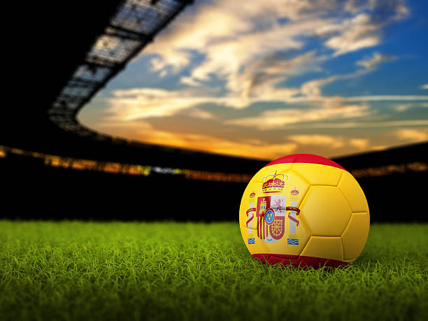Soccer Background with Ball and Spain Flag Soccer Stadium Background with Ball, Spain Flag. High detailed 3D of Soccer ball with national flag and grass against stadium derbyshire photos stock pictures, royalty-free photos & images