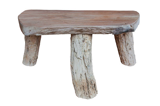 istock Three-legged chair made from old wood. 512035054