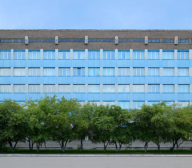 istock Blue building and trees in front of him. Background. 512035174