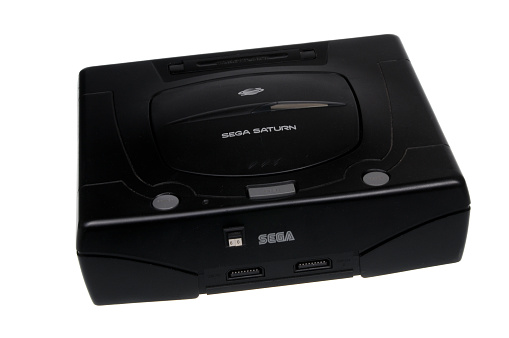 Adelaide, Australia - February 23, 2016: A studio shot of a Black Sega Saturn console,isolated on a white background. A popular game console sold by Sega worldwide between 1994 and 1998. Over 9 million consoles were sold worldwide during this time.