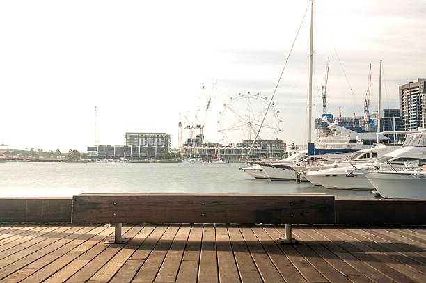 istock Wooden bench located by the yacht pier 512036620