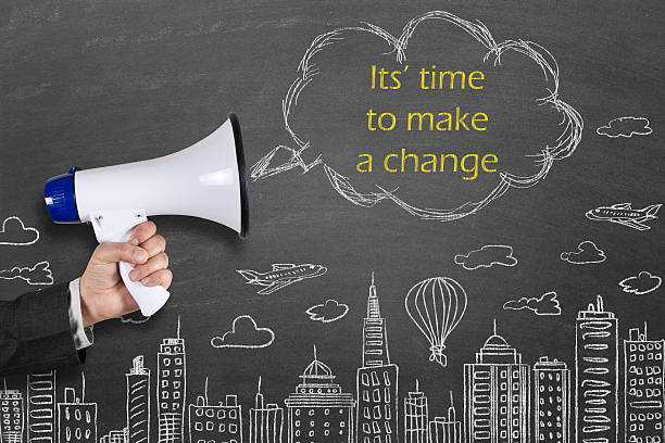 istock Hand holding megaphone with It's time to make a change 512039494