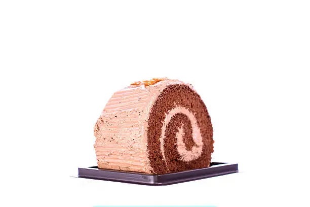 Chocolate cake-roll on white background