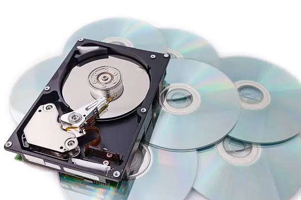 Photo of Hard Disk drives on disk stack with white background