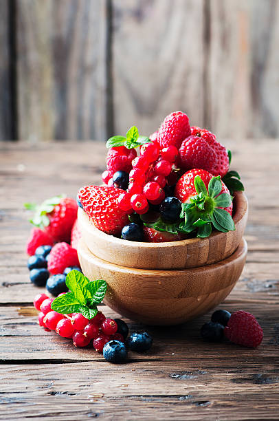 istock Mix of berry on the wooden table 512043252