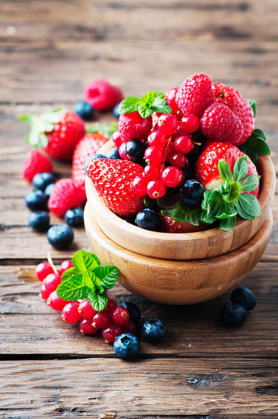 istock Mix of berry on the wooden table 512043308
