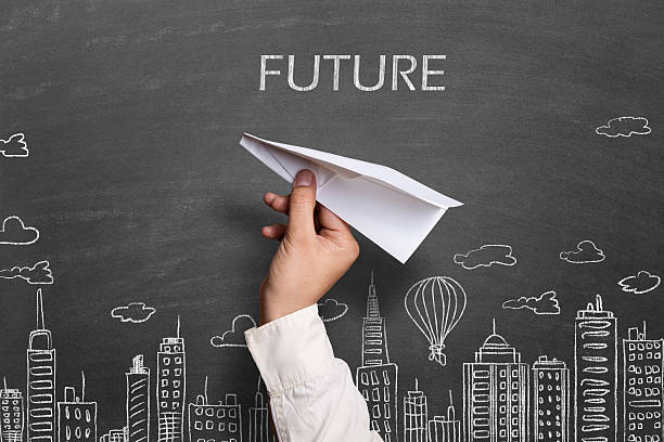 istock Child throwing white paper airplane against cityscape background 512043610