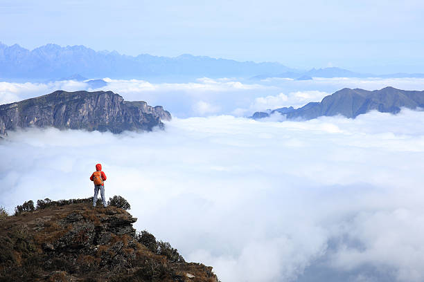 istock young woman hiker  on beautiful mountain peak 512043656