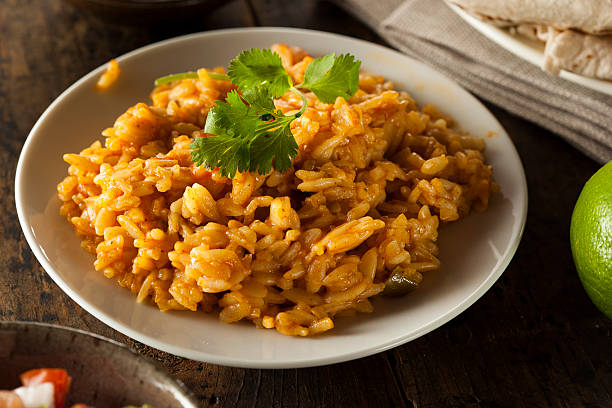 casa di riso speziato messicana - flavored rice foto e immagini stock