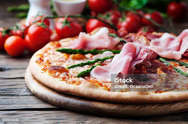 Italian Pizza With Ham And Asparagus Stock Photo - Download Image Now - Asparagus, Basil, Cheese