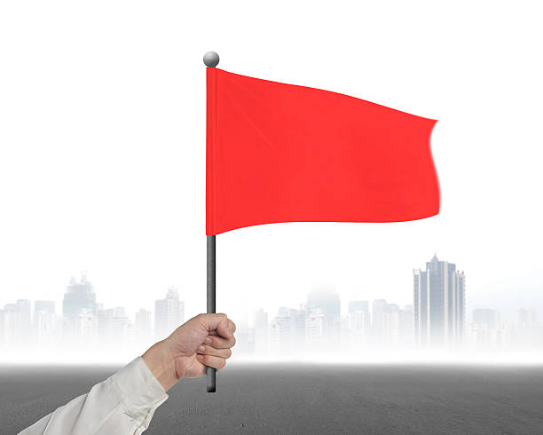 istock Hand holding red wavy flag with mist city 512044096