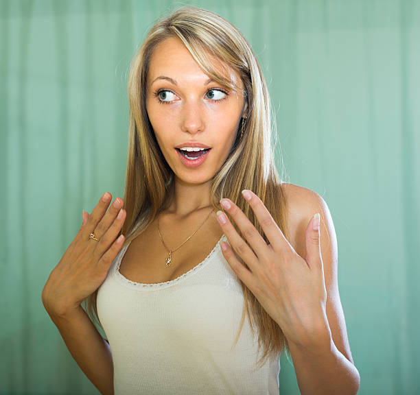 Girl surprised close up shoot Young long-haired woman surprised expression close up shoot wonderingly stock pictures, royalty-free photos & images