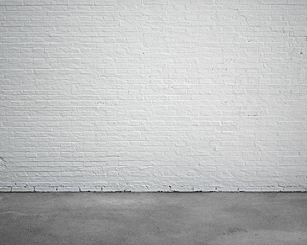 istock room interior with white brick wall and concrete floor 512044468