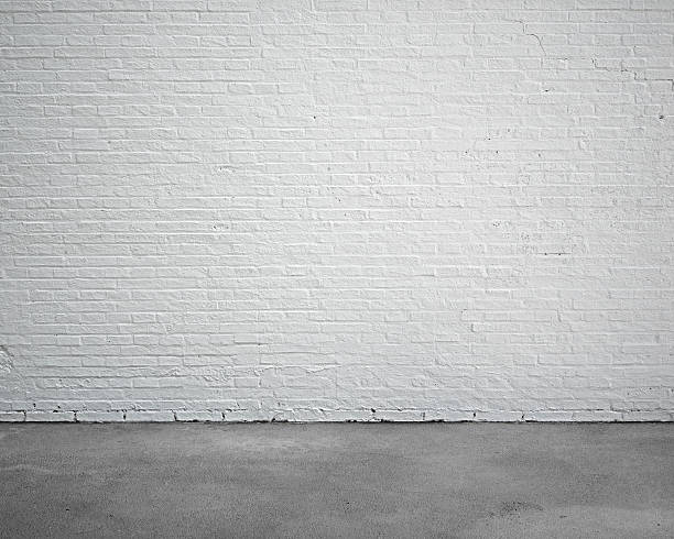room interior with white brick wall and concrete floor stock photo