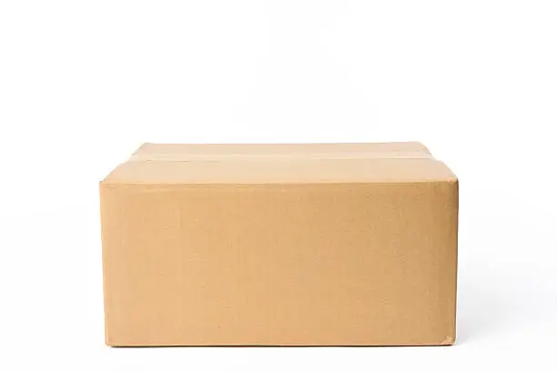 Photo of Isolated shot of closed rectangular cardboard box on white background