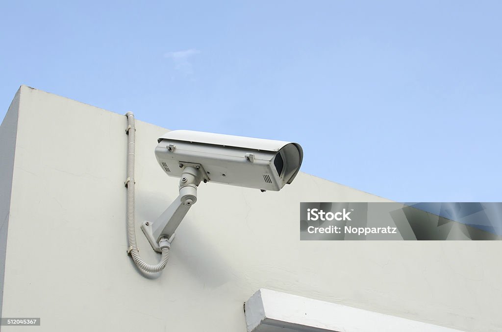 CCTV camera on a wall watch rigth CCTV camera on a wall watch rigth. Camera - Photographic Equipment Stock Photo