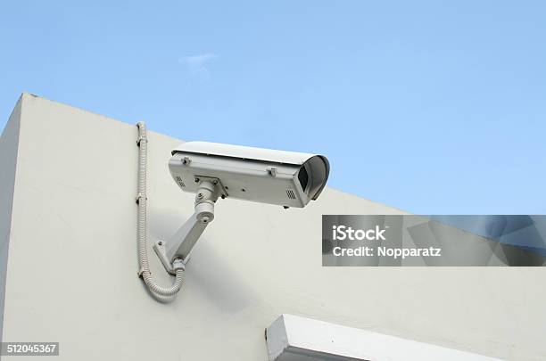 Cctv Camera On A Wall Watch Rigth Stock Photo - Download Image Now - Camera - Photographic Equipment, Control, Discovery