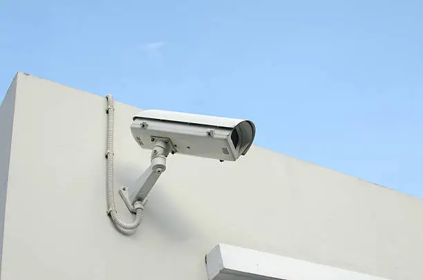 CCTV camera on a wall watch rigth.