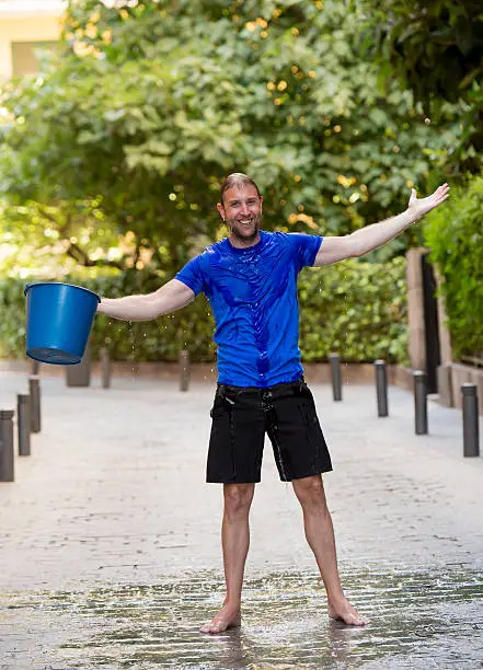 Photo of man pouring ice bucket on internet viral media campaign