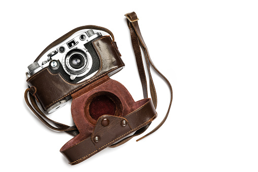 A classic 35 mm camera from 1939 with brown leather case
