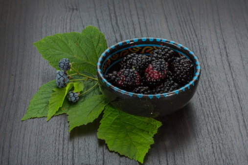 Blackberry with leaves in the bowl