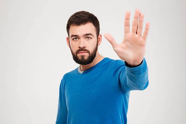 istock Man showing stop sign with palm 512050196