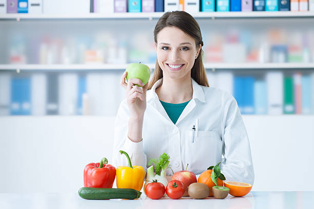 istock Smiling nutritionist in her office 512051072