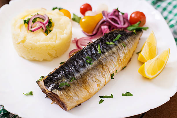 istock Baked mackerel with herbs and garnished with mashed potatoes 512051574