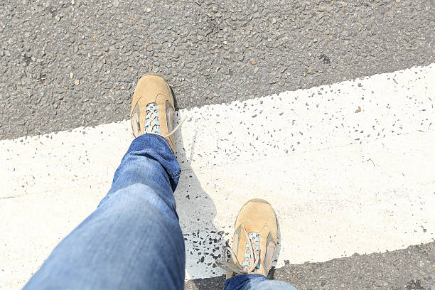 istock people legs walking on zebra crossing road 512051602