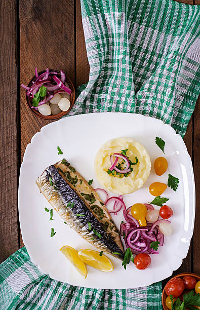 istock Baked mackerel with herbs and garnished with mashed potatoes 512051648