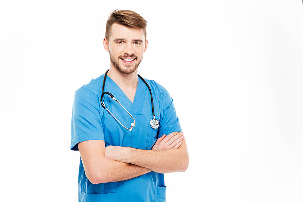 istock Smiling male doctor standing with arms folded 512051654