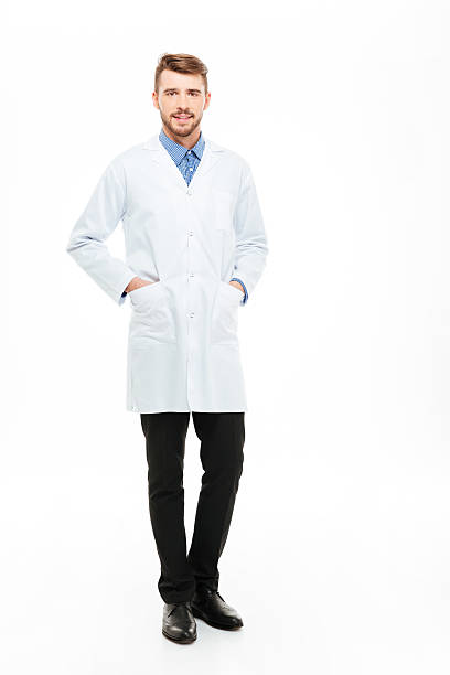 istock Male doctor standing and looking at camera 512052386