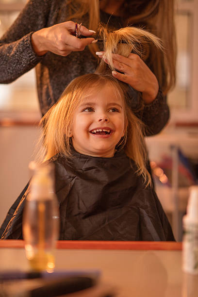Cute Little Girl During Hair Cut At Hair Salon Stock Photo - Download Image  Now - Cutting Hair, Girls, Hairstyle - iStock