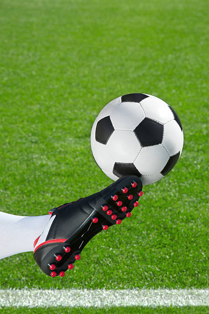istock Soccer player kicking the ball 512055054