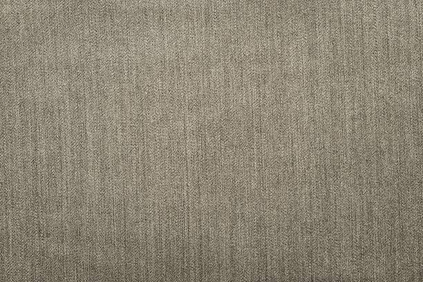 istock rough texture denim fabric monochrome background of beige color 512055674